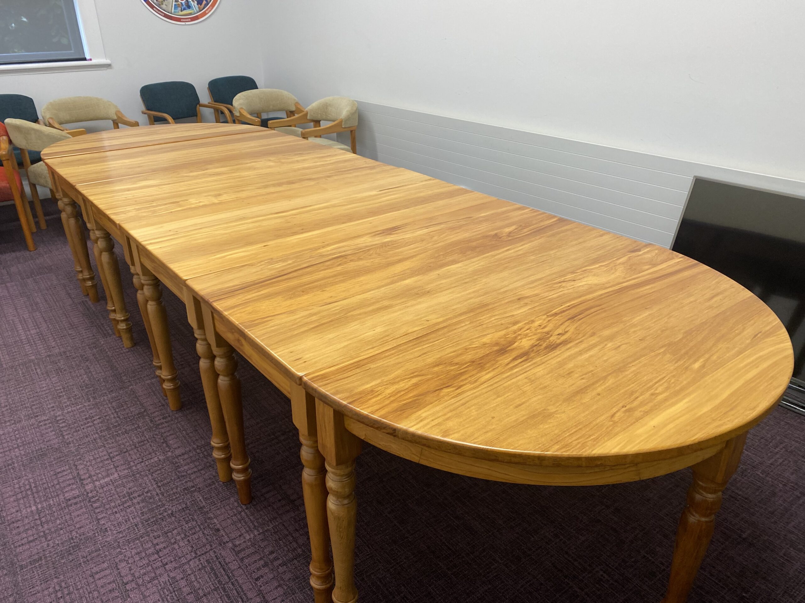 Wooden boardroom table that has been restored and repolished by Kilmister Furniture Restoration.