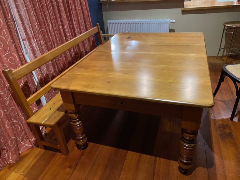 Large dining table and bench seat that have been restored and repolished by Kilmister Furniture Restoration.