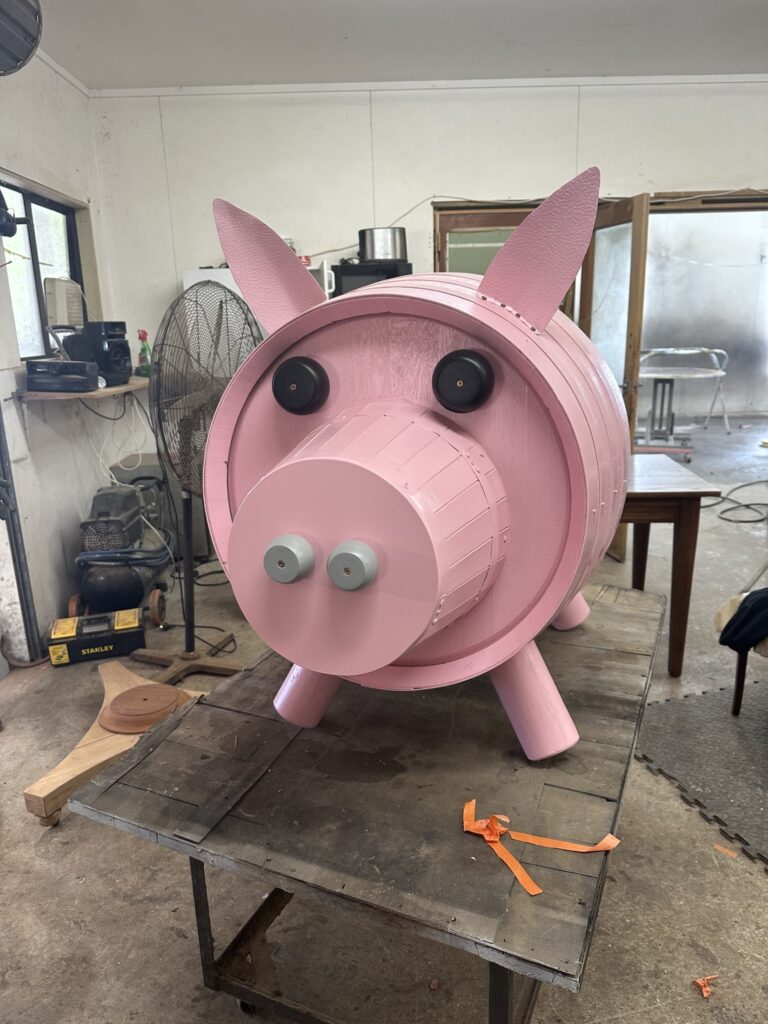 Upcycled wine barrel turned into a decorative pig.