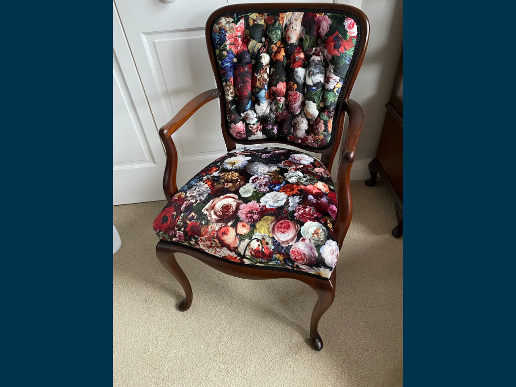 Arm chair that has been reupolstered and restored.