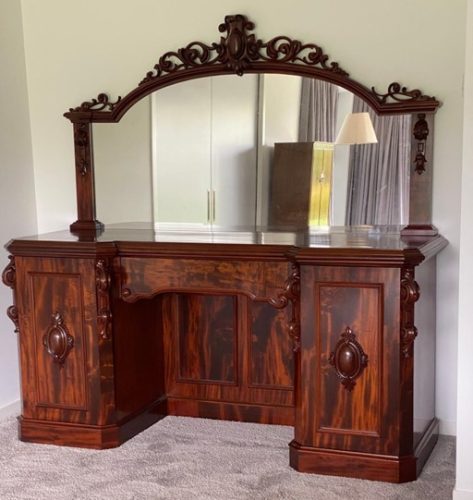 Furniture dresser with a mirror that shows stunning wood grain after being French polished by Kilmister Furniture Restoration.